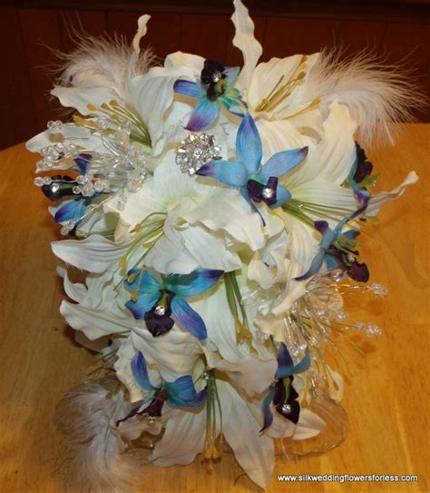 Ivory stargazer lily bouquet with soft white feathers from www ...