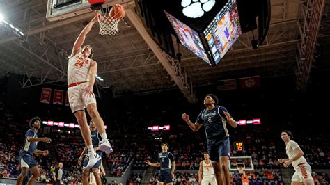 Hall scores 27 to lead No. 18 Clemson to 109-79 rout of Queens