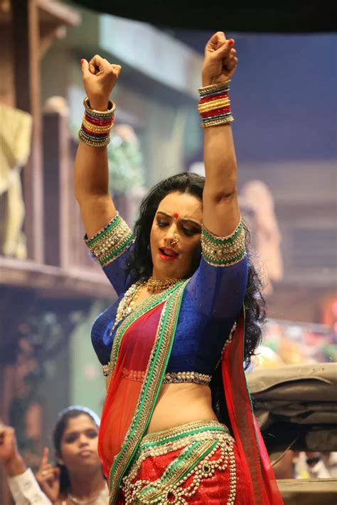 Malayalam Actress Shweta Menon In Red Saree From Kalimannu Movie Song