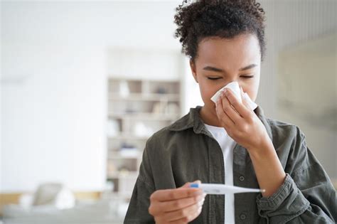 Premium Photo Unhealthy Mixed Race Girl Blowing Nose Measure