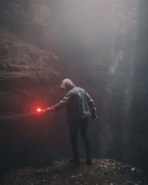 HD Wallpaper Man On Edge Of Cliff Holding Signal Flare Light Man In