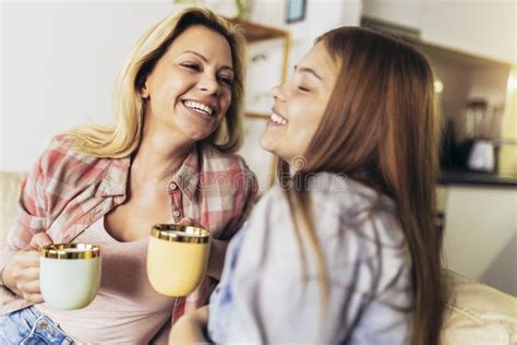 Mother And Daughter Drink Tea Or Coffee Stock Image Image Of Laughing