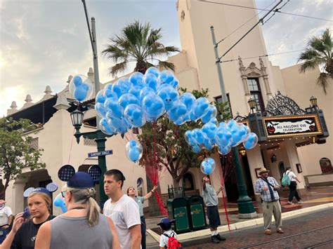 Free Buttons Ear Hats And Balloons Distributed To Guests At The