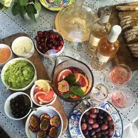 A Table Topped With Bowls Filled With Different Types Of Food Next To