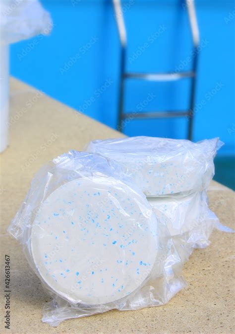 White Chlorine Tablet In The Hand Of Maintenance Personnel For