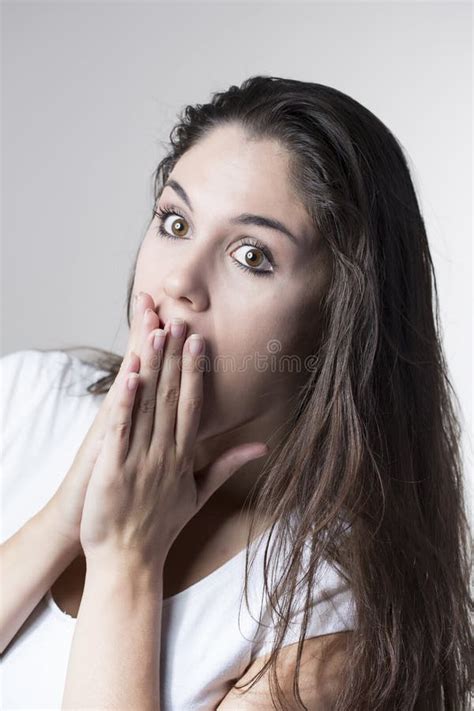 Portrait Of A Young Brunette Woman Making Faces With Different E Stock