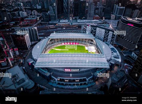 An aerial view of Marvel stadium with bright green grass and red sign ...