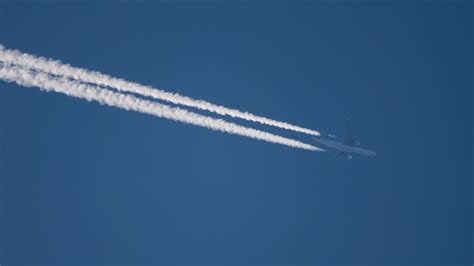 Widebody Airplane Flying At High Altitude With Contrail 17194142 Stock