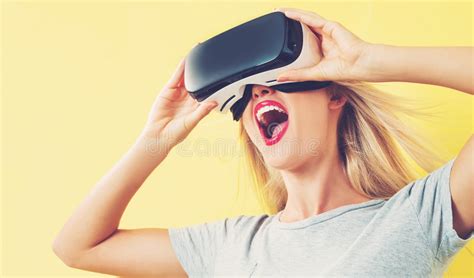 Curious Smiling Woman In A White Shirt Wearing Oculus Rift Vr Virtual