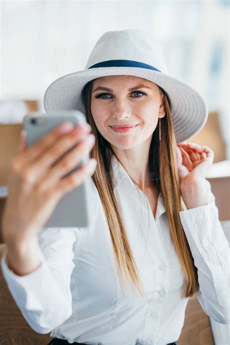 Beautiful Tourist Girl In International Airport Taking Funny Selfie