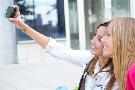 Two Friends Taking Photos With A Smartphone Stock Image Image Of