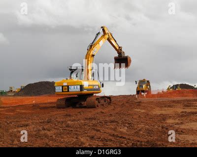 Jcb Excavator Digger Loading A Tipper Lorry With Earth From Basement