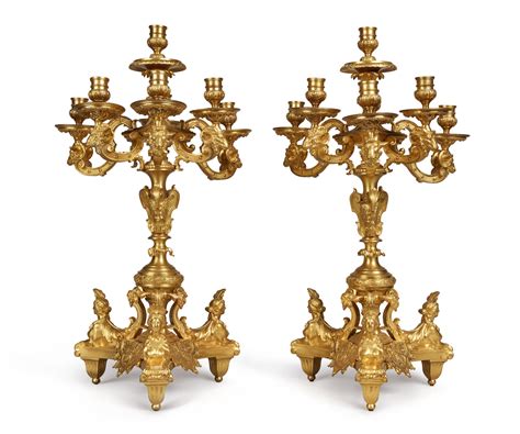 A PAIR OF FRENCH LOUIS XIV STYLE GILT BRONZE SEVEN LIGHT CANDELABRA