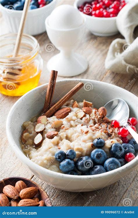 Healthy Breakfast Oatmeal Porridge With Berries Nuts And Honey Stock