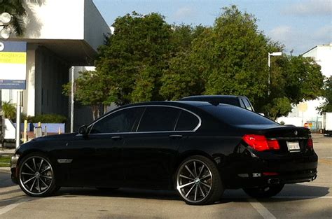 Exotic Cars on the Streets of Miami: Black BMW 750i with custom Vossen rims