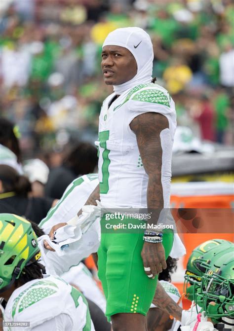 Bucky Irving Of The Oregon Ducks Watches From The Sidelines During A