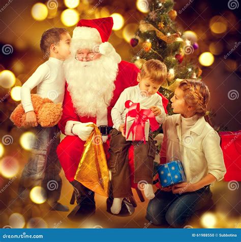 Santa Claus Giving Christmas Gifts To Children Stock Photo - Image of ...