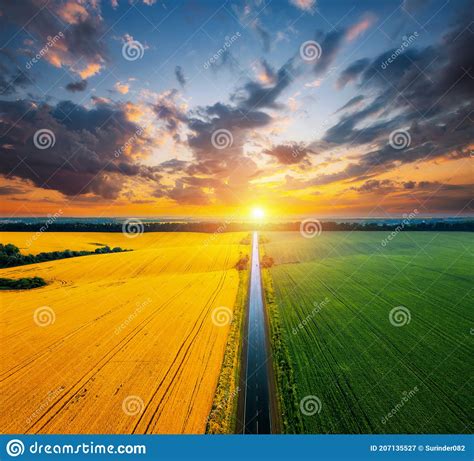 Aerial Top View Of Rural Road Passing Through Agricultural Land And