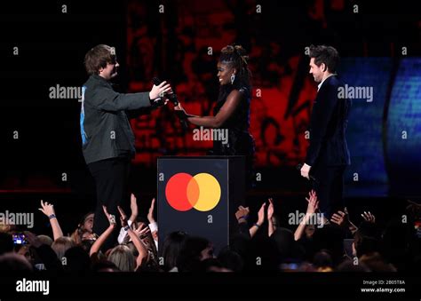 Clara Amfo And Niall Horan Present Lewis Capaldi With An Award On Stage