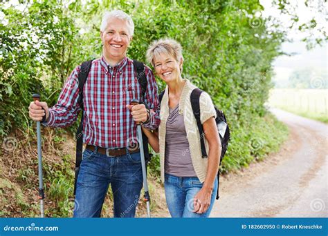 Couple Of Seniors Hiking In Summer Stock Photo Image Of Citizens