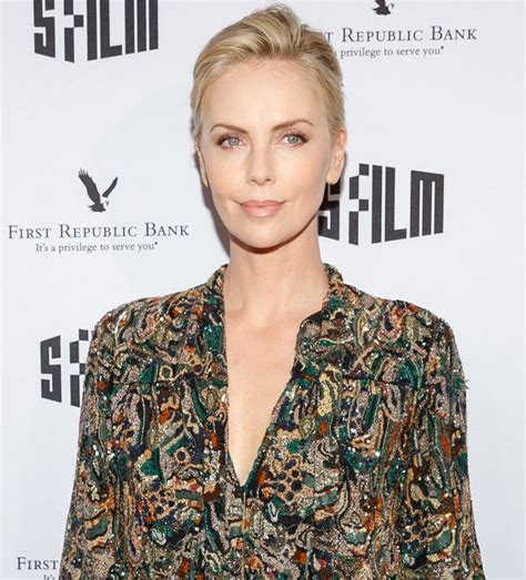 Charlize Theron In Leather High Waist Shorts And Strappy Sandals