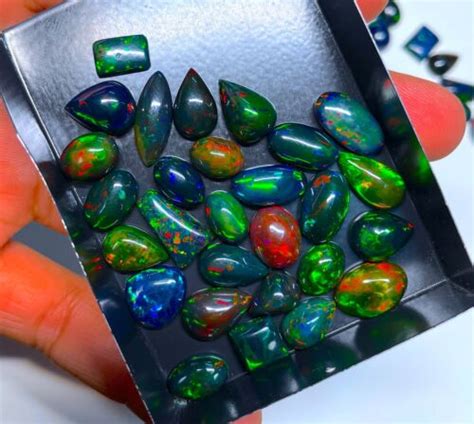 AAA Qualität natürlicher schwarzer Opal lose Edelsteine Cabochons Menge