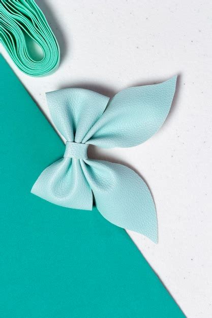 Premium Photo | Blue hair bow on table with blue fabric and ribbon