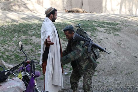 An Afghan National Army Soldier Searches An Afghan Nara And Dvids