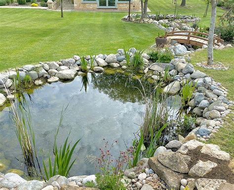 Wildlife Pond With A Bridge And Stream Ponds By Michael Wheat