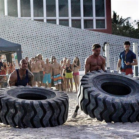 Baywatch Cast Photo: A Rock on a Beach with Some Babes