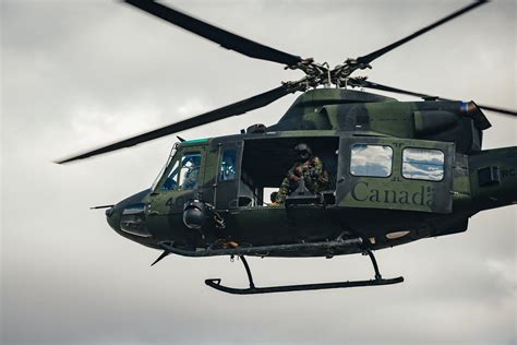 A Canadian Armed Forces CH-146 Griffon helicopter takes off during Exercise MAPLE RESOLVE in ...