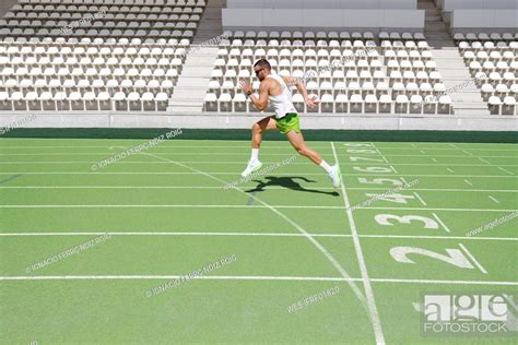 Athlete running on sports field, Stock Photo, Picture And Royalty Free ...