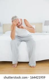 Full Length Mature Man Suffering Headache Stock Photo