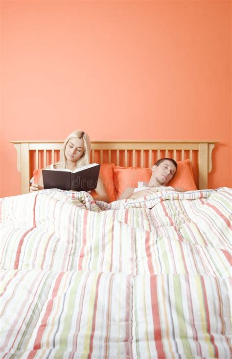 Couple Reading In Bed Stock Image Image Of Enjoyment 12892903