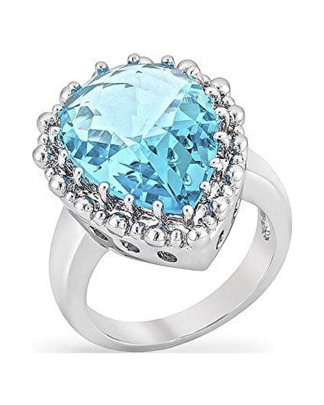 Genuine Rhodium Plated Blue Topaz Pear Cocktail Ring With Faceted Blue