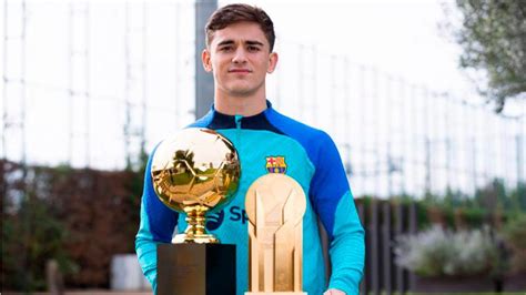 Gavi Shows Off Golden Boy Prize And Kopa Trophy To Diario Sport