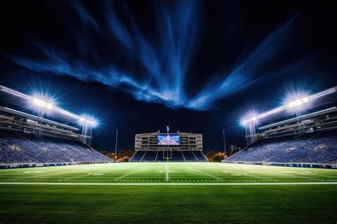 Premium AI Image | Football stadium at night with lights and grass ...