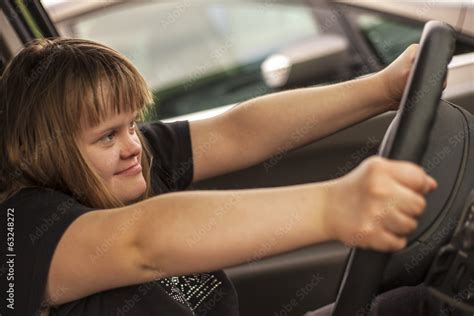 Jeune Fille Trisomique Au Volant D Une Voiture Stock Photo Adobe Stock