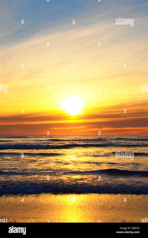 sunset at piha beach, new zealand Stock Photo - Alamy