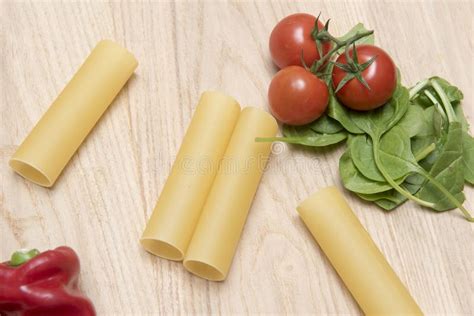 Dried Cannelloni Pasta With Tomato And Spinach Leaves Stock Image