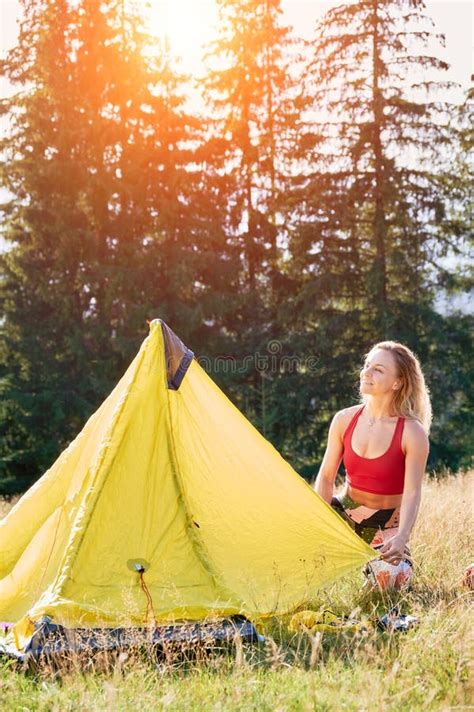 Slim Blonde Woman Sitting On Grass Putting Tent Stock Image Image