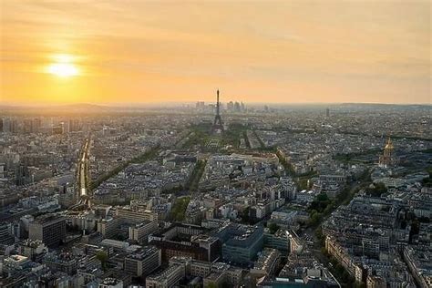 Aerial view of Paris with Eiffel tower at sunset in Paris