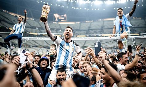 Messi Holding World Cup Trophy