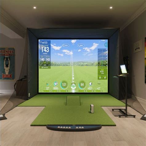 An Indoor Golf Simulator Is Shown On The Wall