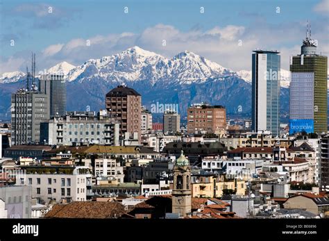 City Skyline In A Clear Day With The Alps In The Background Milan