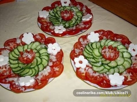 Three Plates With Cucumbers And Tomatoes On Them Sitting On Top Of A Table