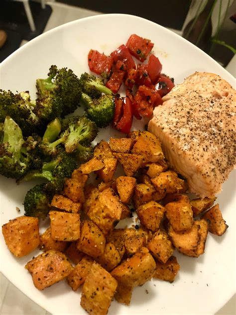 Oven Baked Salmon With Roasted Sweet Potatoes Garlic Broccoli And Red