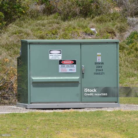 Small Power Transformer Electrical Substation On Concrete Plinth In The