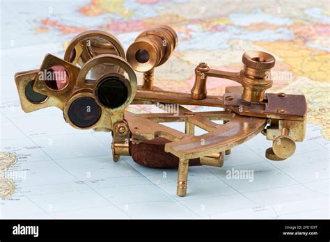 Nautical Sextant With Optics Lying On Paper World Map Stock Photo Alamy