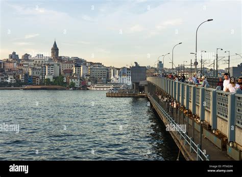 Galata Bridge With Fishermen Fishing In Late Afternoon Light Karakoy